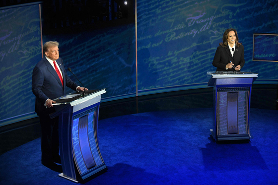 Donald Trump, left, and Kamala Harris square off in a U.S. presidential debate at the National Constitution Center in Philadelphia, Pennsylvania, on Tuesday. [AFP/YONHAP]