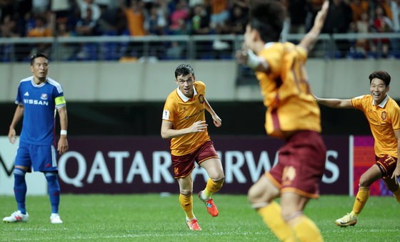 Gwangju FC midfielder Jasir Asani, center, celebrates scoring a goal during a 2024-25 AFC Champions League Elite league stage match against the Yokohama F. Marinos at Gwangju Football Stadium in Gwangju on Tuesday. [YONHAP]