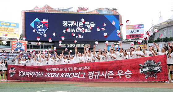 The Kia Tigers celebrate after winning the 2024 KBO pennant at Incheon SSG Landers Field in Incheon on Tuesday.  [YONHAP]