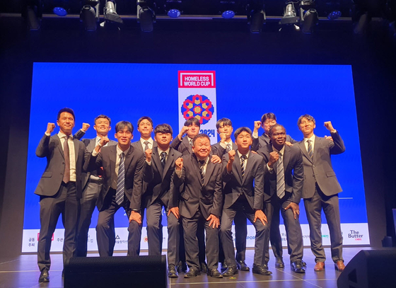 The Korean national team for the 2024 Homeless World Cup poses with their coaching staff during a launch ceremony at Roh Moo-Hyun Civic Center in central Seoul on Sept. 4. [NEWS1] 