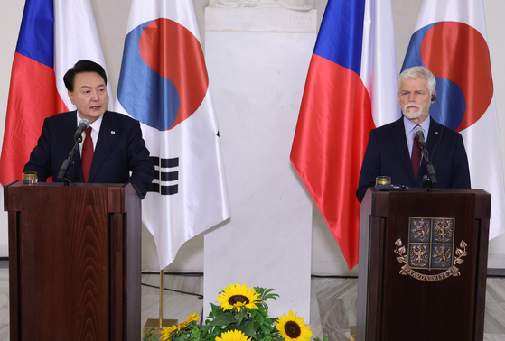 President Yoon Suk Yeol, left, and Czech President Petr Pavel speak during a joint press conference at the Prague Castle Thursday following their bilateral summit as the Korean leader makes a four-day official visit to the Czech Republic. [JOINT PRESS CORPS] 