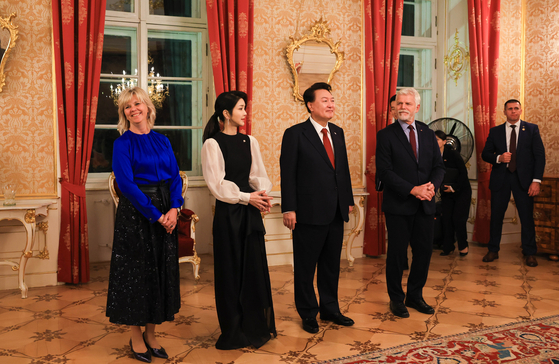 President Yoon Suk Yeol, center right, and first lady Kim Keon Hee, center left, and Czech President Petr Pavel, right, and first lady Eva Pavlova, left, pose for a commemorative photo at the Prague Castle Thursday ahead of an official dinner banquet. [JOINT PRESS CORPS]