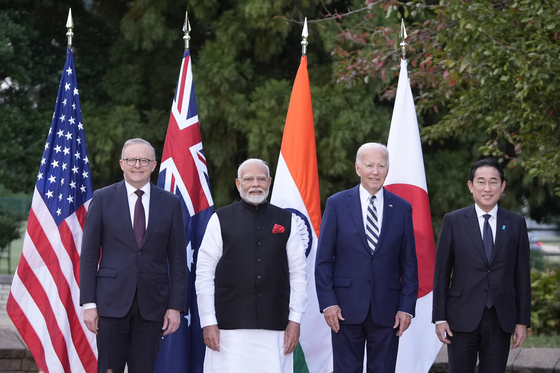 From left, Australian Prime Minister Anthony Albanese, Indian Prime Minister Narenda Modi, U.S. President Joe Biden and Japanense Prime Minister Fumio Kishida stand for a group photo before speaking during the Quad leaders summit at Archmere Academy in Claymont, Delaware, on Saturday. [AP/YONHAP]