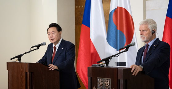 President Yoon Suk Yeol, left, speaks during a joint press conference with Czech President Petr Pavel at the Prague Castle Thursday following their bilateral summit during the Korean leader's official visit to the Czech Republic. [PRESIDENTIAL OFFICE] 