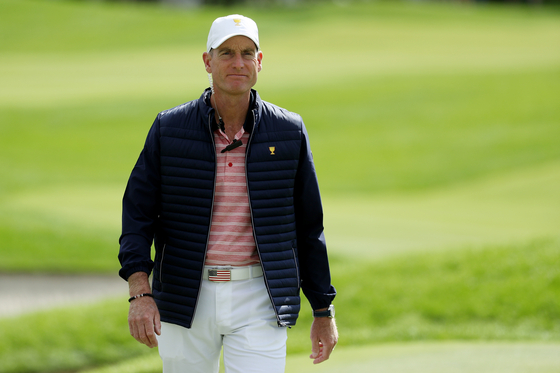 Captain's assistant Jim Furyk of the U.S. Team walks during Friday four-ball matches of the Presidents Cup at Liberty National Golf Club on Sept. 29, 2017 in Jersey City, New Jersey. [GETTY IMAGES]