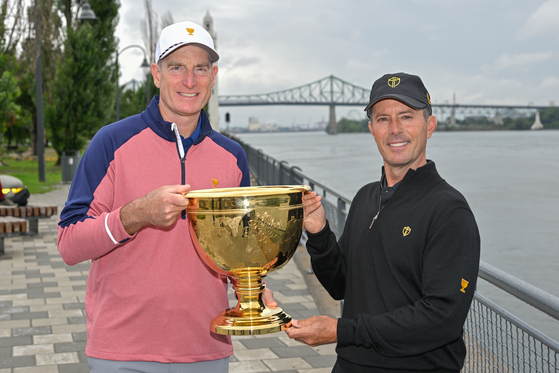 United States team captain Jim Furyk and International team captain Mike Weir walk around Old Montreal, Quebec, Canada, on Sept. 13, 2023. [GETTY IMAGES]