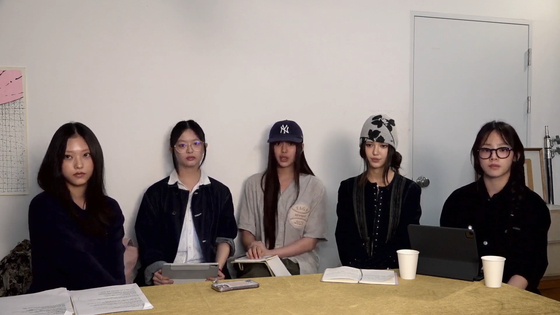 Members of girl group NewJeans hold a YouTube livestream on Sept. 11. [SCREEN CAPTURE]