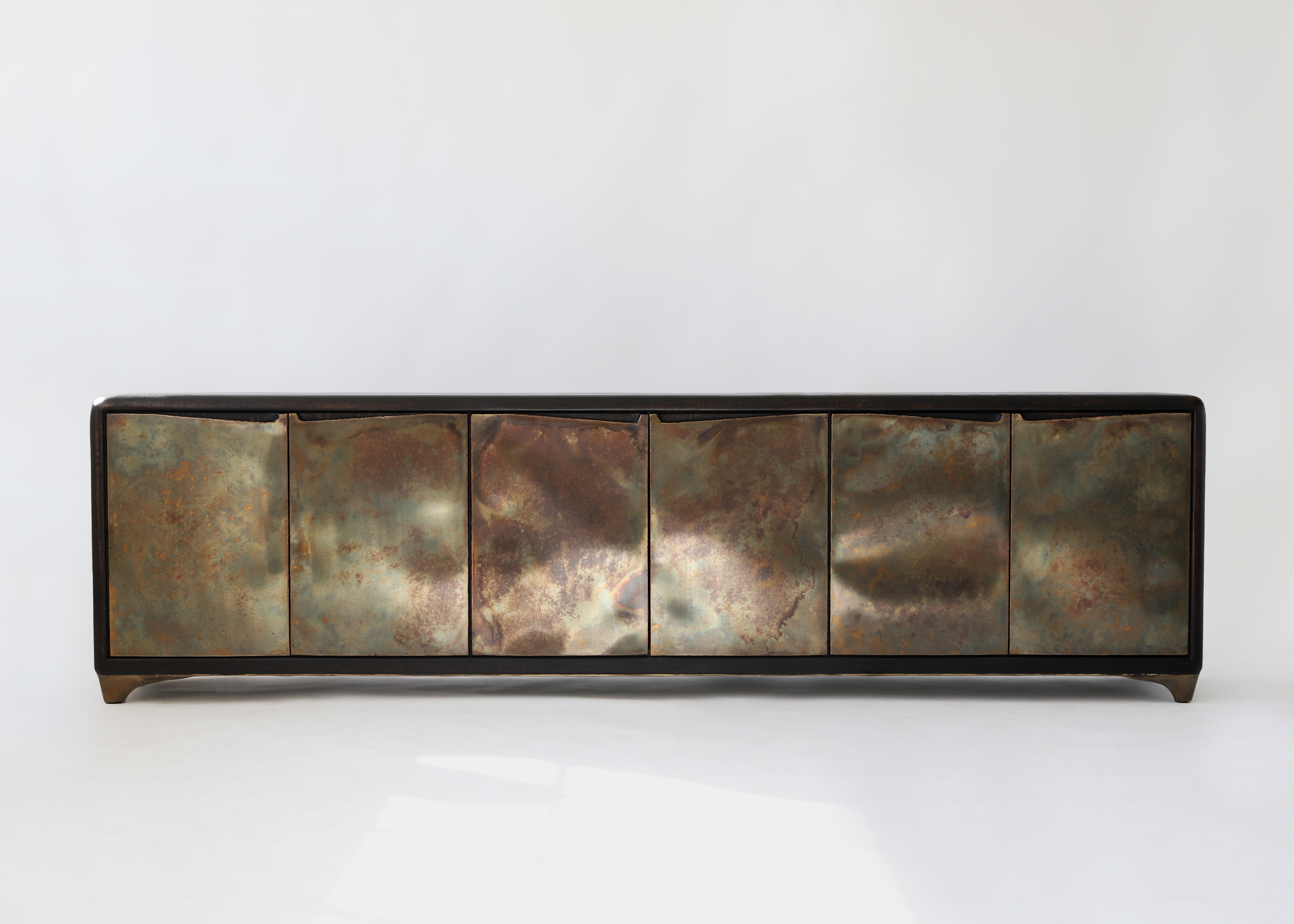 A credenza by Valentin Loellmann, made from charred oak and brass [THE EDIT]