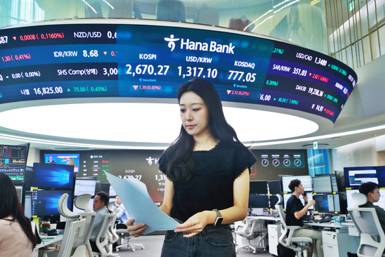 A screen in Hana Bank's trading room in central Seoul shows the Kospi opening on Friday. [YONHAP]