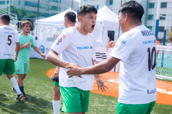 The Mexican men's team celebrate at the 2024 Homeless World Cup at Hanyang University in eastern Seoul.  [HOMELESS WORLD CUP]