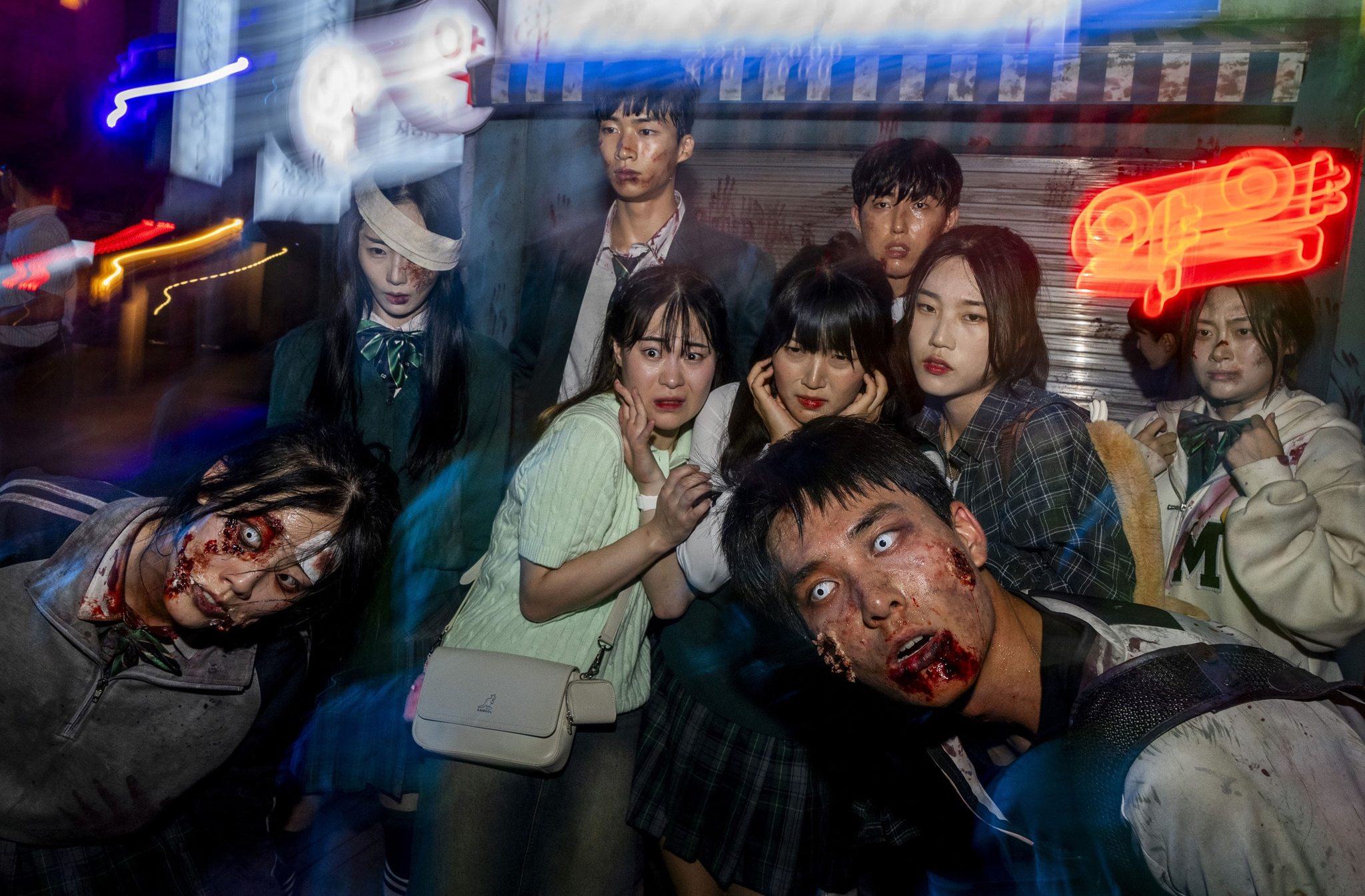 Visitors take pictures with zombies at Everland's Blood City zone. [SAMSUNG C&T]