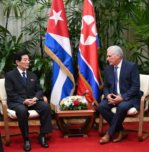 This image, capture from the website of the Cuban presidential office, shows Cuban President Miguel Diaz-Canel, right, with North Korea's new ambassador to Cuba, Han Su-chol, during their meeting on Friday. [YONHAP]