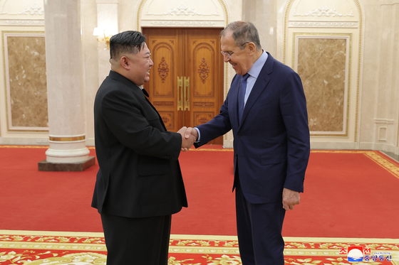 North Korean leader Kim Jong-un, left, shakes hands with Russian Foreign Minister Sergey Lavrov during a meeting in Pyongyang on Oct. 19, 2023. [YONHAP]