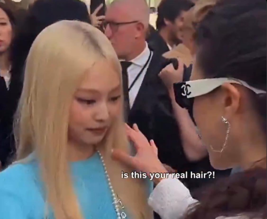 Margaret Qualley is shown in this viral video on X asking Jennie if her blonde hair is real during Chanel's Paris Fashion Week show on Tuesday. [SCREEN CAPTURE]