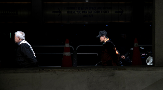 Pedestrians stroll near Tapgol Park in central Seoul on Friday. [NEWS1] 