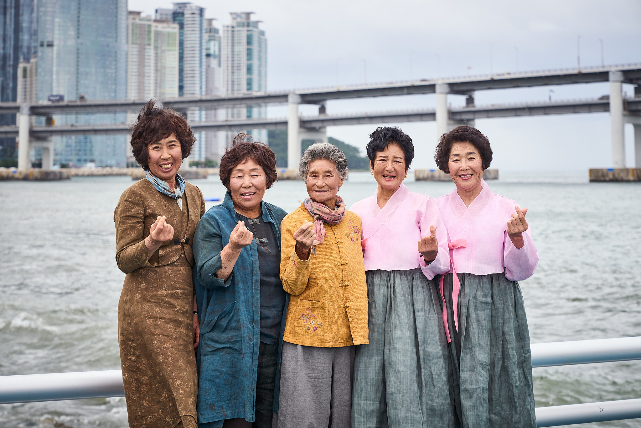 The haenyeo of documentary film "The Last of the Sea Women" pose for a photo. From left, haenyeo Kang Joo-hwa, Jeong Young-ae, Lee Geum-ok, Park In-sook and Hyun In-hong [APPLE TV+]