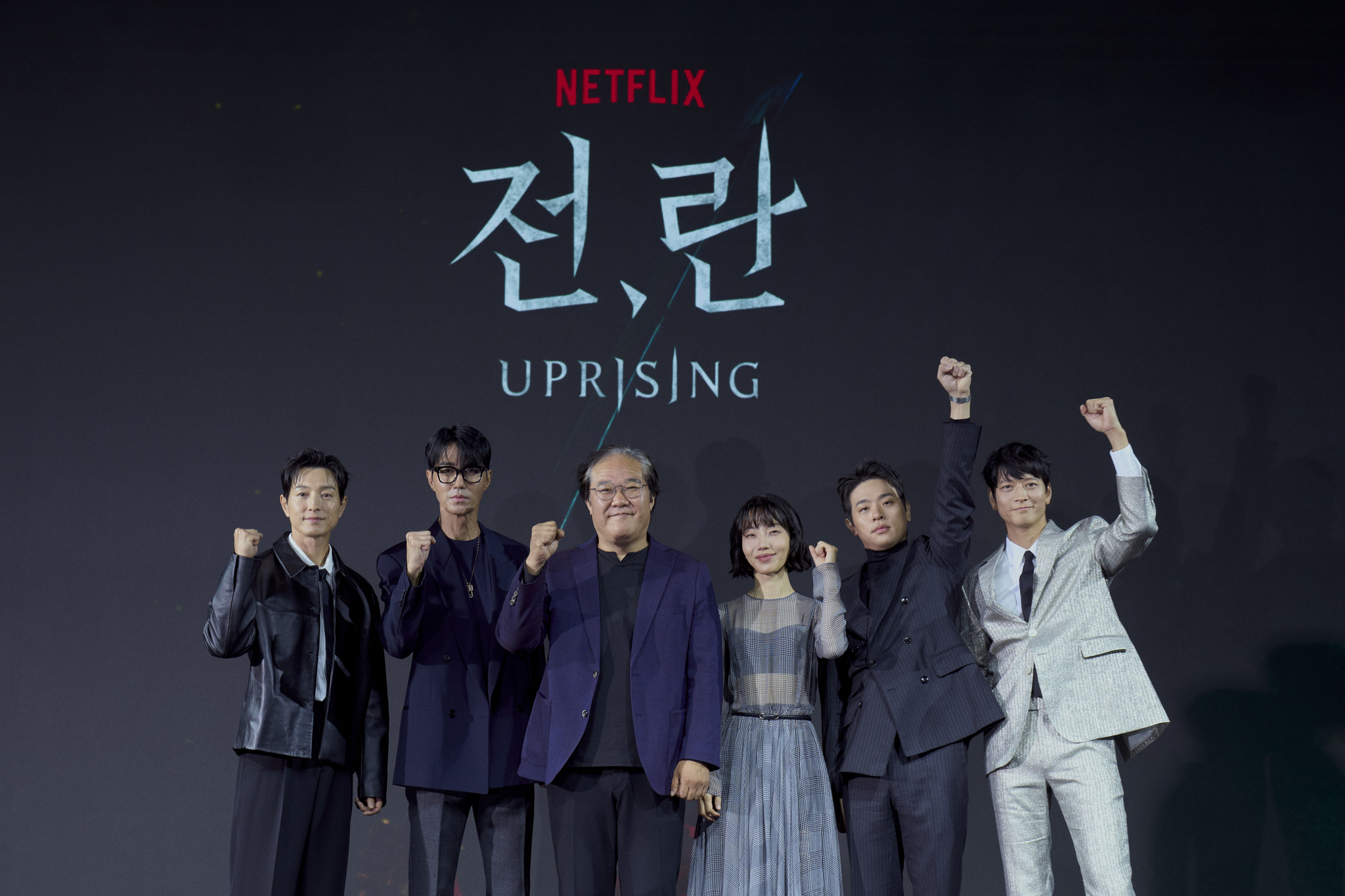 From left, actors Jung Sung-il, Cha Seung-won, director Kim Sang-man, actor Kim Shin-rock, Park Jeong-min and Gang Dong-won pose for a photo during the film's press conference held in Dongdaemun District, eastern Seoul, on Thursday. [NETFLIX]     