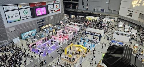 Visitors attend an exhibition in Tokyo promoting Korea's pop culture.