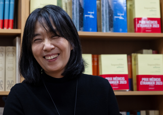 Han Kang, winner of the Nobel Prize in Literature, smiles during an interview with Korean correspondents on Nov. 10 in Paris. [NEWS1]