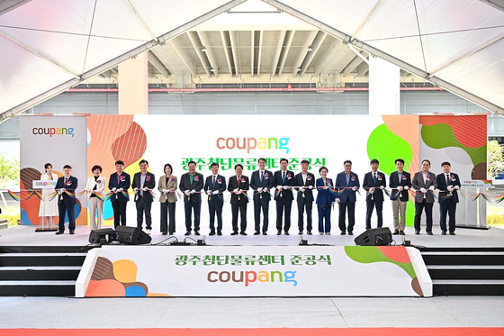 Coupang executives hold a ribbon-cutting ceremony for the e-commerce platform's completed logistics center in Gwangju, South Jeolla on Oct. 14. [COUPANG]