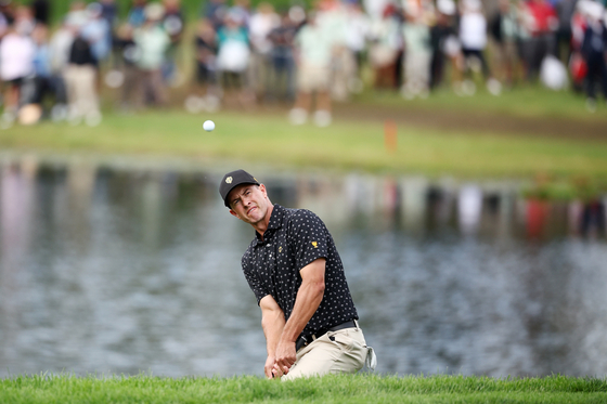 Adam Scott and the International Team play a shot on the 16th hole on day one of the 2024 Presidents Cup at The Royal Montreal Golf Club on Sept. 26 in Montreal, Quebec, Canada. [GETTY IMAGES]