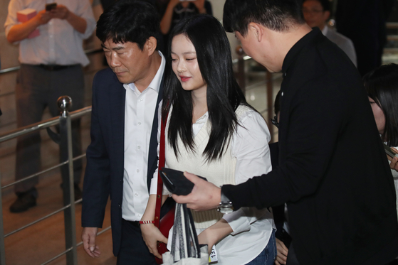 Hanni of girl group NewJeans arrives at the National Assembly in western Seoul to attend a parliamentary audit by the Environment and Labor Committee on Oct. 15. [NEWS1]