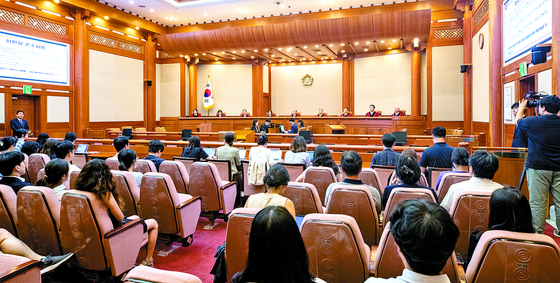 Constitutional Court Chief Justice Lee Jong-seok and other Constitutional Court justices are seated in the courtroom of the Constitutional Court in Jongno District, central Seoul, on Aug. 29. [YONHAP]