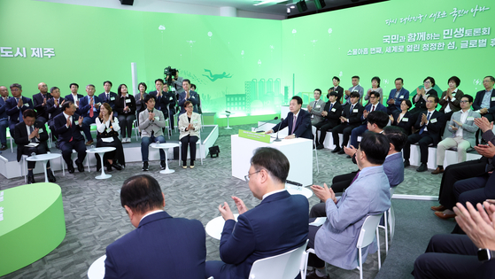 President Yoon Suk Yeol, center, speaks during the 29th Public Policy Dialogue session held at the Jeju Free International City Development Center on Jeju Island on Tuesday. [JOINT PRESS CORPS]