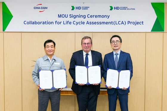 From left, HD Hyundai Samho CEO Shin Hyeon-dae, CMA-CGM’s Xavier Leclercq, vice president and head of CMA ships, and HD Hyundai Marine Solution’s managing director and chief financial officer, Kim Jung-hyuk, pose for a photo after a signing ceremony on the three companies' agreement to collaborate on the Life Cycle Assessment project. [HD HYUNDAI MARINE SOLUTION]