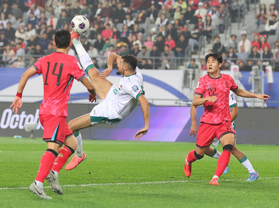 Iraq's Aymen Hussein kicks the ball during a 2026 World Cup qualifer against Korea at Yongin Mireu Stadium in Yongin, Gyeonggi on Tuesday. [YONHAP]