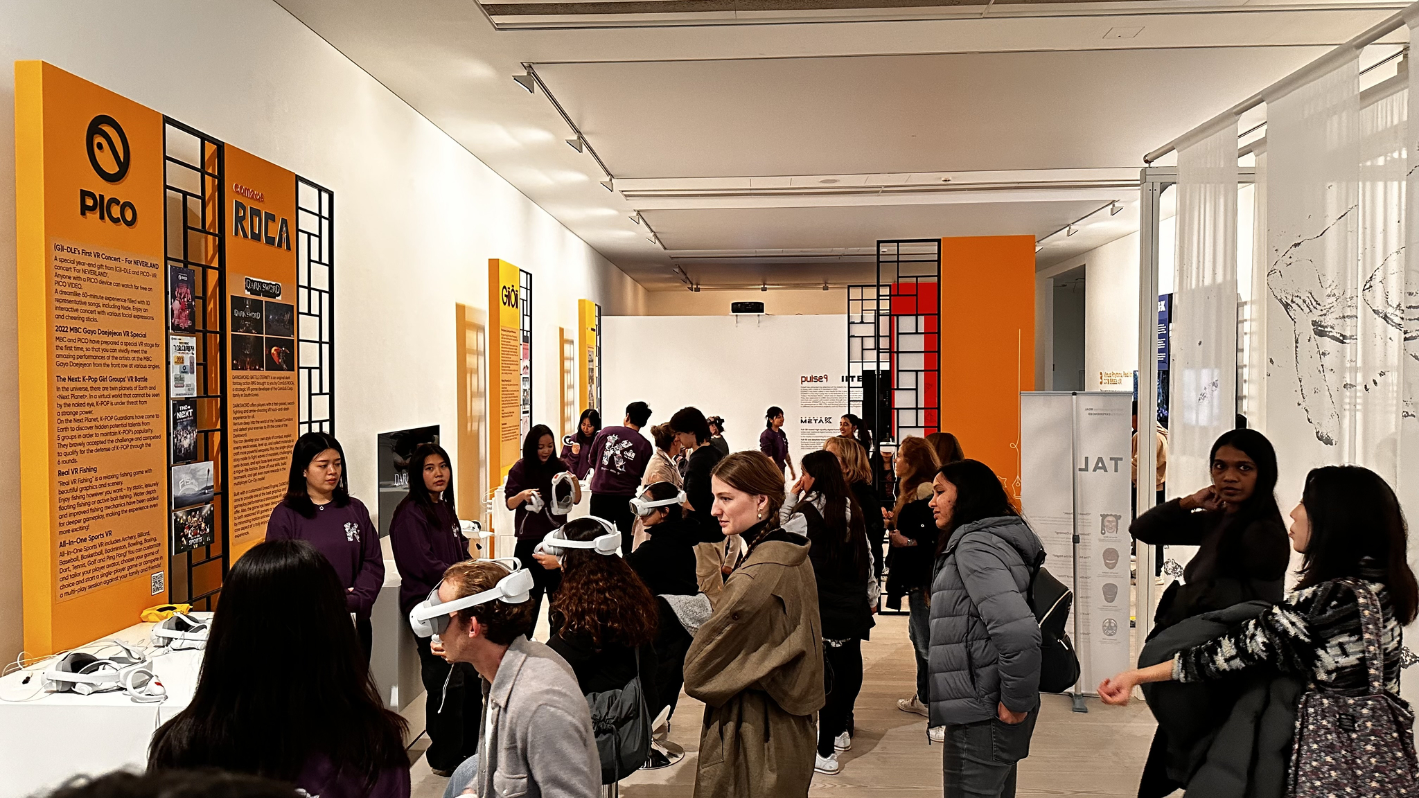 Visitors look around displayed work at The Oulim held at Saatchi Gallery in London in October last year. [YONHAP]