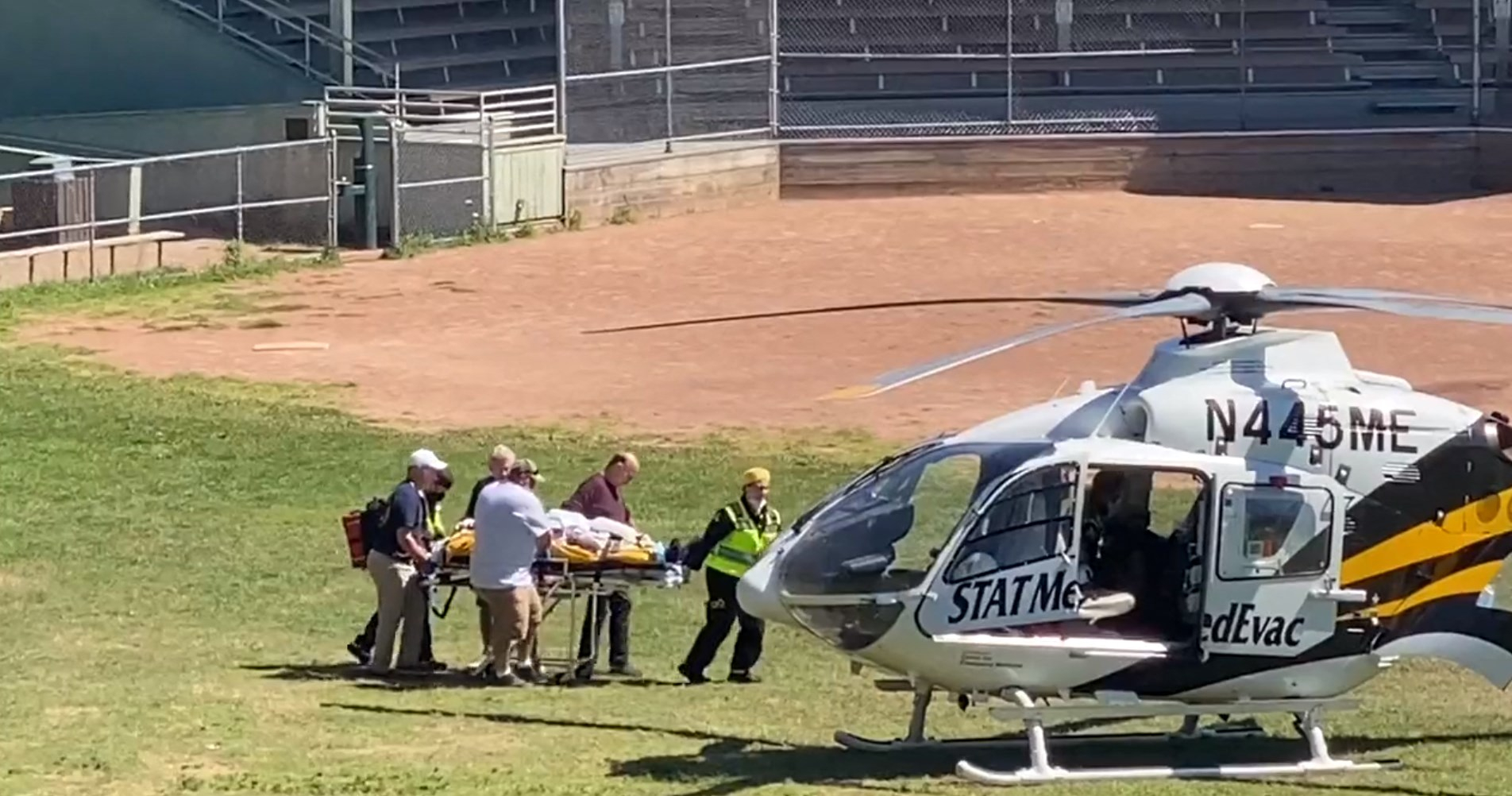 Salman Rushdie, in a video from Aug. 12, 2022, is seen being loaded onto a medical evacuation helicopter near the Chautauqua Institution after being stabbed in the neck while speaking on stage in Chautauqua, New York. [AFP/YONHAP] 