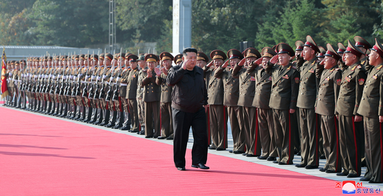 North Korean leader Kim Jong-un is greeted by military officials during his visit to the 2nd Corps of the Korean People's Army on Thursda. [KOREAN CENTRAL NEWS AGENCY]