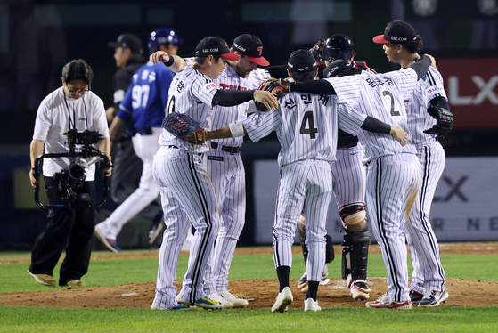 LG Twins players celebrate their 1-0 win over the Samsung Lions in Game 3 of the second round in the Korea Baseball Organization postseason at Jamsil Baseball Stadium in Seoul on Oct. 17, 2024. [YONHAP]