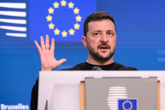 Ukrainian President Volodymyr Zelensky speaks at a press conference on the margins of a EU summit in Brussels on Thursday. [AFP)/Zelensky]