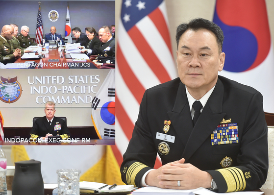 In a photo provided by South Korea's Joint Chiefs of Staff (JCS), JCS Chairman Adm. Kim Myung-soo, right, holds the annual Military Committee Meeting with his U.S. counterpart, Gen. Charles Q. Brown Jr., center in top left photo, and U.S. Adm. Samuel Paparo, bottom left photo, commander of the Indo-Pacific Command. [YONHAP]