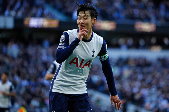 Tottenham Hotspur captain Son Heung-min celebrates scoring during a Premier League match against West Ham at Tottenham Hotspur Stadium in London on Saturday. [AFP/YONHAP] 