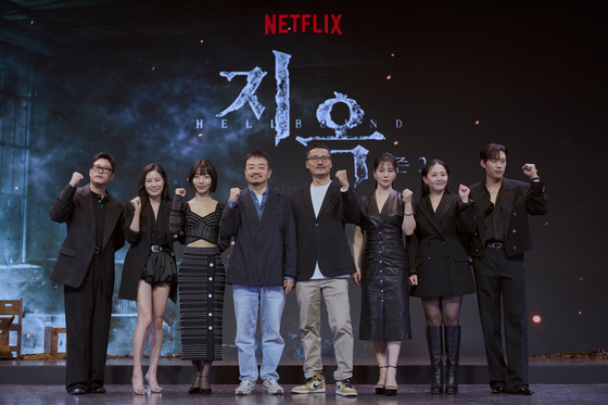 The cast, director and writer pose for a photo during the press conference for the second seasn of Netflix's horror thriller series ″Hellbound″ held in Jongno District, central Seoul, on Monday. From left are actors Im Sung-jae, Moon So-ri, Kim Shin-rock, director Yeon Sang-ho, writer Choi Gyu-seok, actors Kim Hyun-joo, Moon Geun-young and Kim Sung-cheol [NETFLIX]