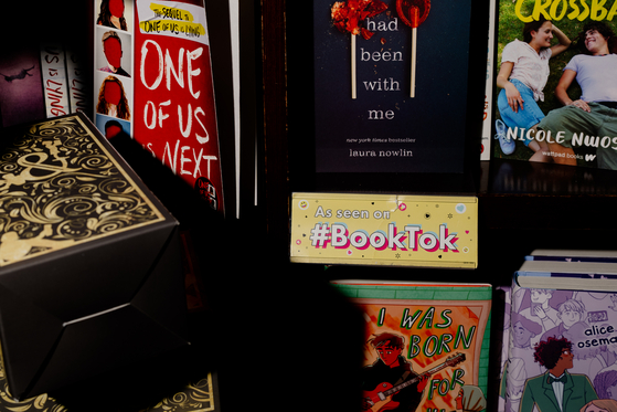 A BookTok display showing several books at a bookstore in Manhattan on June 14, 2023. Younger readers and BookTok influencers like having physical books to hold up in videos and display on their shelves. (Amir Hamja/The New York Times)