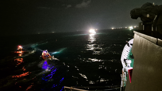 The Korea Coast Guard conducts a search and rescue mission in waters approximately 24 kilometers (15 miles) northwest of Biyang Island, under the jurisdiction of Jeju Island, on Friday morning. [KOREA COAST GUARD] 