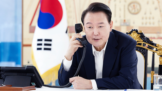 President Yoon Suk Yeol speaks on the phone with U.S. President-elect Donald Trump on Thursday. [PRESIDENTIAL OFFICE]