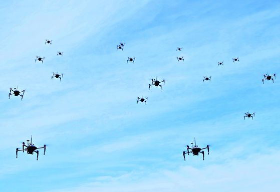 Dozens of military-grade drones developed by the Agency for Defense Development fly during a test in March 2020. Image is unrelated to the article. [JOONGANG ILBO]