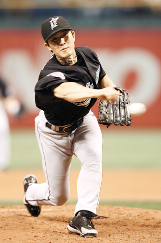 Winning pitcher Byung-Hyun Kim of the Colorado Rockies heads to